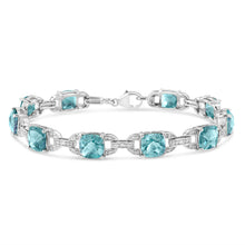 Load image into Gallery viewer, .925 Sterling Silver 7x7 mm Cushion Cut Blue Topaz and 1/20 cttw Round Cut Diamond Fashion Tennis Bracelet (I-J Color, I1-I2 Clarity) - 7"