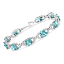 Load image into Gallery viewer, .925 Sterling Silver 7x7 mm Cushion Cut Blue Topaz and 1/20 cttw Round Cut Diamond Fashion Tennis Bracelet (I-J Color, I1-I2 Clarity) - 7"
