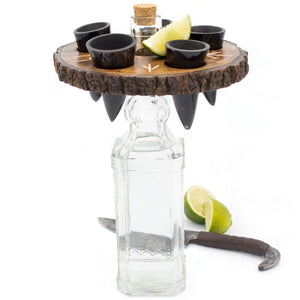 Tequila set with wooden coaster, shot glasses, and lime wedges on a white background