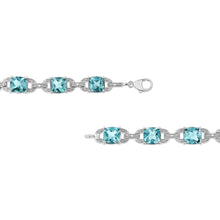 Load image into Gallery viewer, .925 Sterling Silver 7x7 mm Cushion Cut Blue Topaz and 1/20 cttw Round Cut Diamond Fashion Tennis Bracelet (I-J Color, I1-I2 Clarity) - 7"
