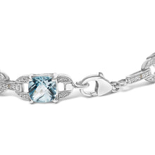 Load image into Gallery viewer, .925 Sterling Silver 7x7 mm Cushion Cut Blue Topaz and 1/20 cttw Round Cut Diamond Fashion Tennis Bracelet (I-J Color, I1-I2 Clarity) - 7"
